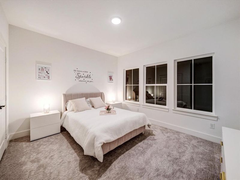 Carpeted bedroom with baseboards Carpeted bedroom with baseboards