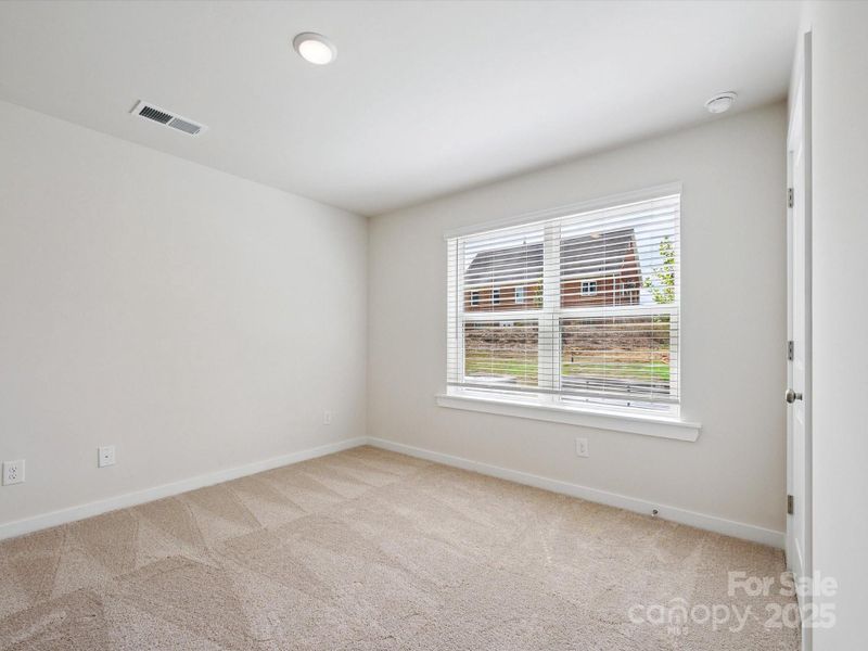 Spacious, unfurnished interior of a new home in Central Living at Craig, Charlotte (Image 29).