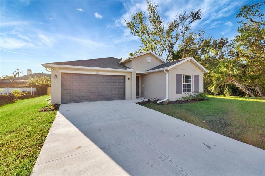 Front exterior of a new home in , Port Charlotte, FL, highlighting curb appeal (Image 2). Front exterior of a new home in , Port Charlotte, FL, highlighting curb appeal (Image 2).