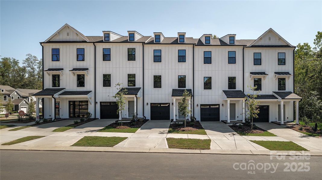 Front exterior of a new home in , Charlotte, NC, highlighting curb appeal (Image 1).
