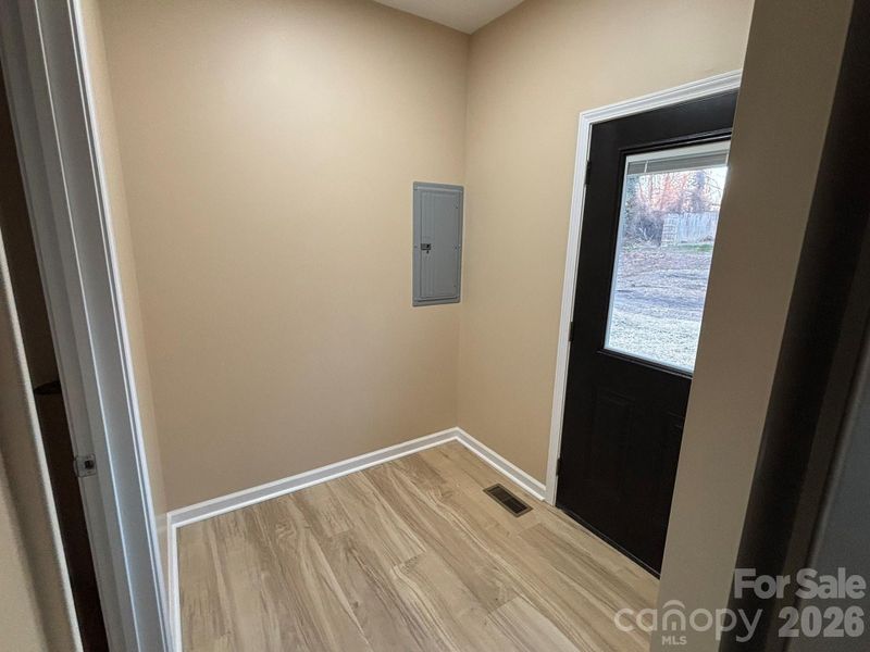 Mud room off of the side deck/entrance.