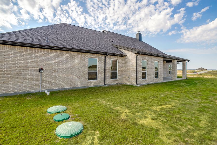 Front exterior of a new home in Rocky Top Ranch, Reno, TX, highlighting curb appeal (Image 30). Front exterior of a new home in Rocky Top Ranch, Reno, TX, highlighting curb appeal (Image 30).