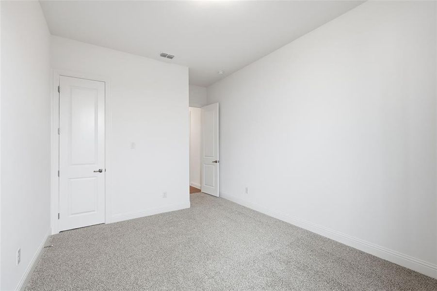 Unfurnished bedroom featuring carpet floors and baseboards Unfurnished bedroom featuring carpet floors and baseboards