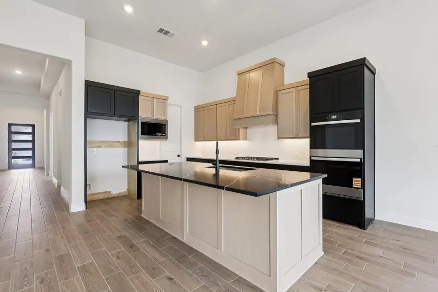 Furnished interior view inside a new home in Sienna 65', Missouri City (Image 7).