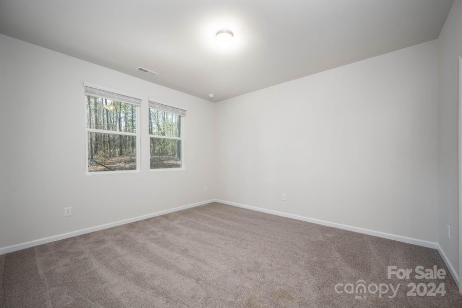 Primary bedroom with full bath and walk0in closet