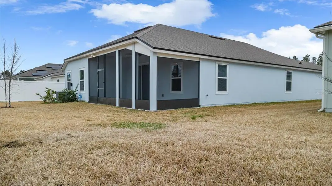 Exterior details and patio area of a home in Sawmill Branch, Palm Coast (Image 3). Exterior details and patio area of a home in Sawmill Branch, Palm Coast (Image 3).