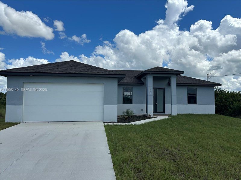 Front exterior of a new home in , Lehigh Acres, FL, highlighting curb appeal (Image 1). Front exterior of a new home in , Lehigh Acres, FL, highlighting curb appeal (Image 1).