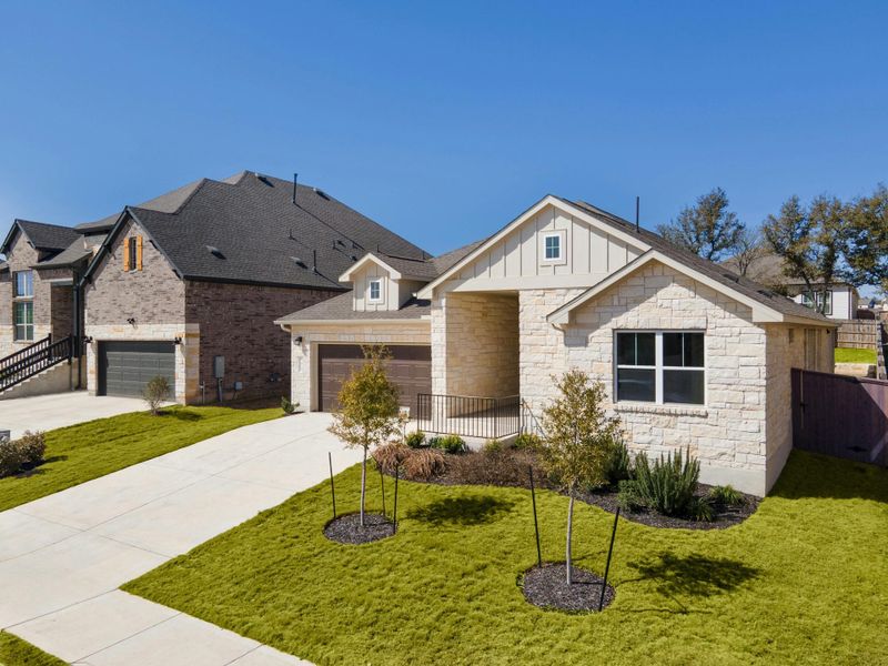 Front exterior of a new home in Anthem, Kyle, TX, highlighting curb appeal (Image 17).