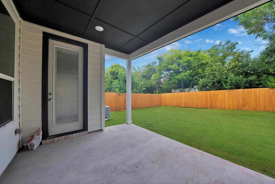 Covered patio with a concrete surface Covered patio with a concrete surface
