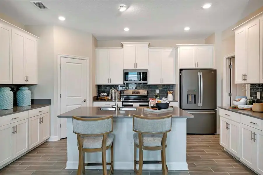 Furnished interior view inside a new home in Tohoqua: Estates Collection, Kissimmee (Image 11).