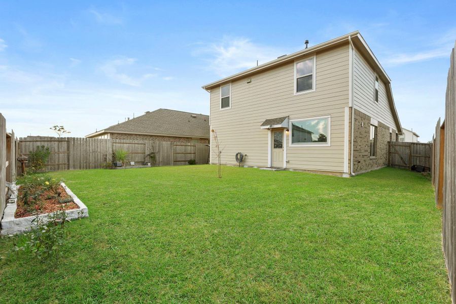 Exterior details and patio area of a home in Tavola: Gulf Coast Collection, New Caney (Image 3).