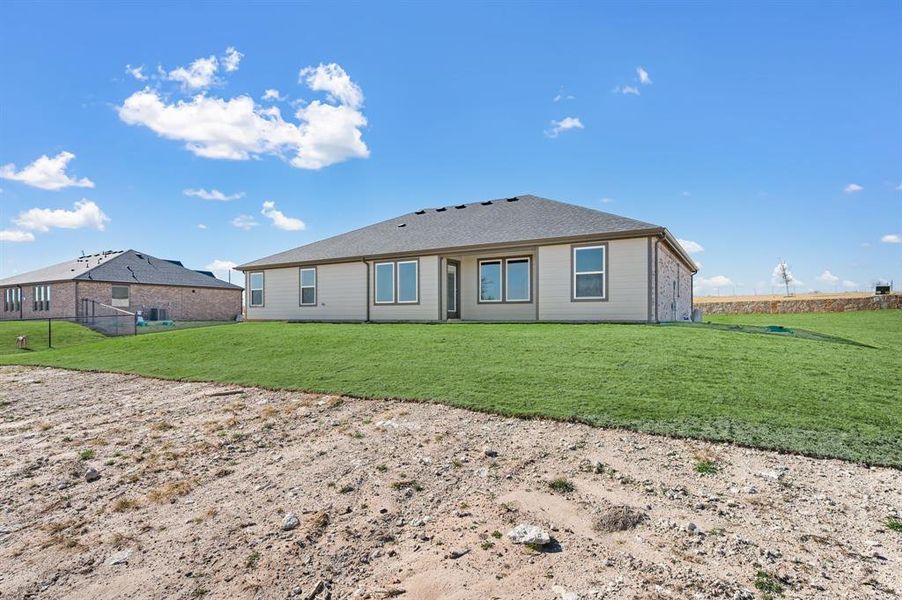 Exterior details and patio area of a home in Gatlin Ranch, Springtown (Image 3).