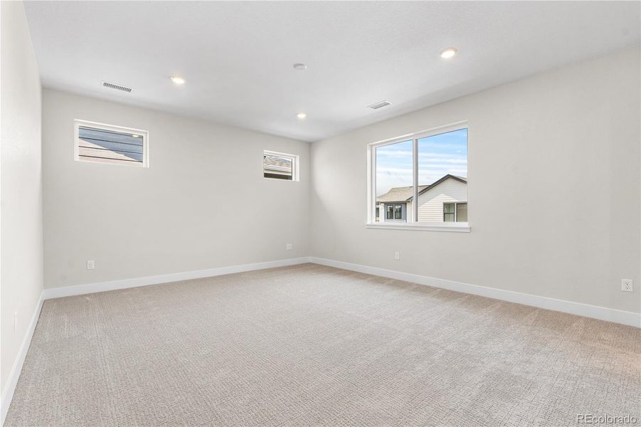 Spacious, unfurnished interior of a new home in Storytellers at Lyric, Lone Tree (Image 25).