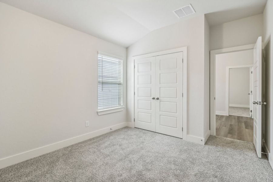 Guest bedroom in the Hughes floorplan at a Meritage Homes community.