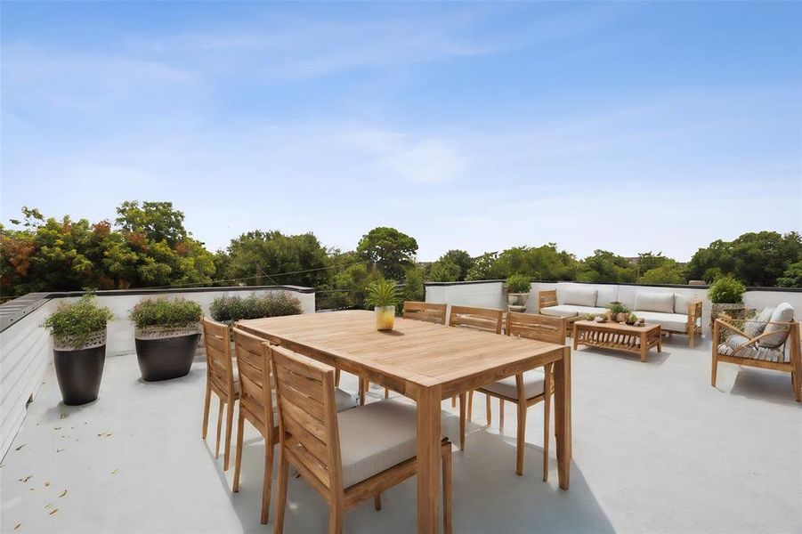 View of third floor roof top terrace featuring outdoor lounge area and views of downtown Dallas