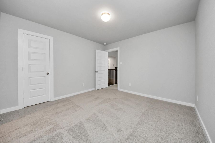 Generously sized secondary bedrooms featuring spacious closets, soft and inviting carpetingunderfoot, large windows allowing plenty of natural light, and the added touch of privacyblinds for your personal retreat.