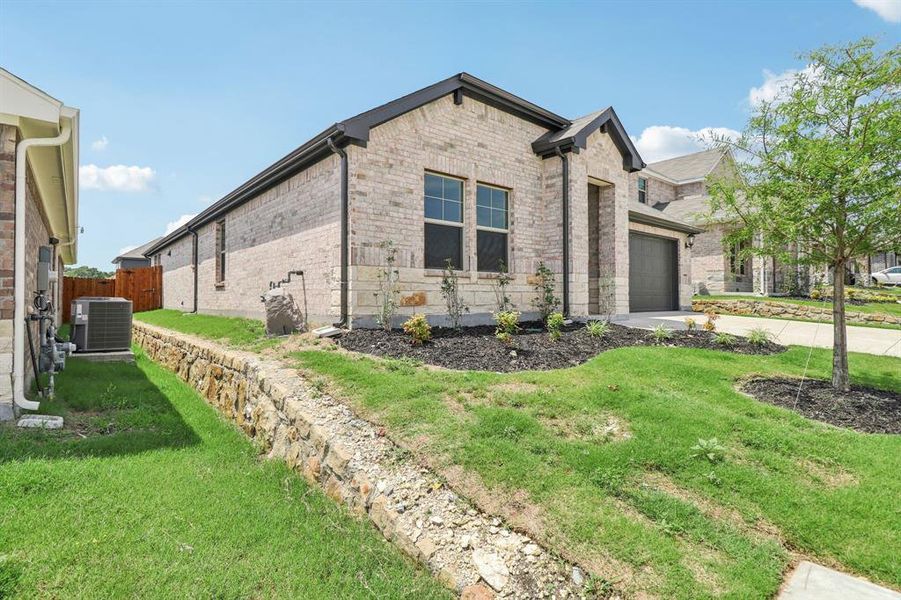 Front exterior of a new home in Westmoor, Sherman, TX, highlighting curb appeal (Image 19).