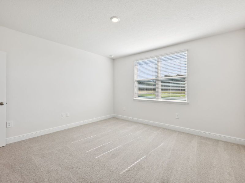 Spacious, unfurnished interior of a new home in The Reserve at Hammock Oaks - Signature Series, Lady Lake (Image 12).