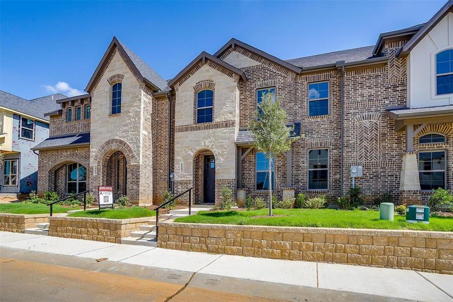 French country home with brick siding and roof with shingles French country home with brick siding and roof with shingles
