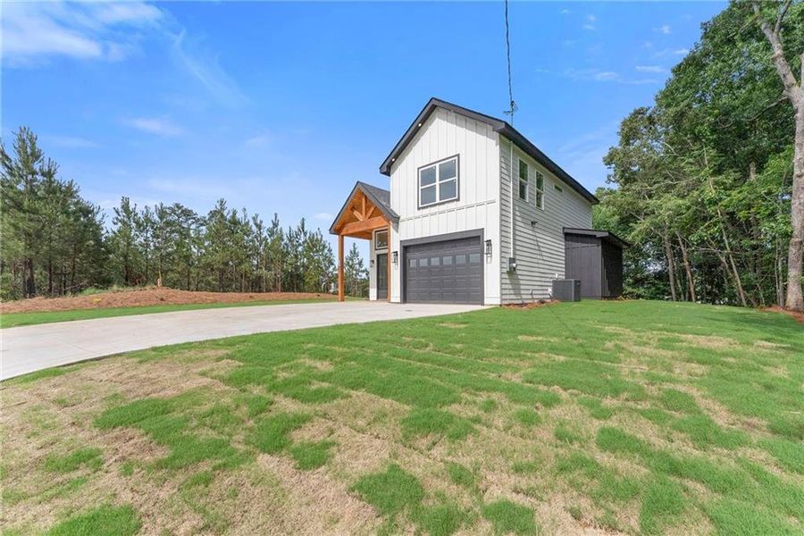 Front exterior of a new home in , Buford, GA, highlighting curb appeal (Image 22).