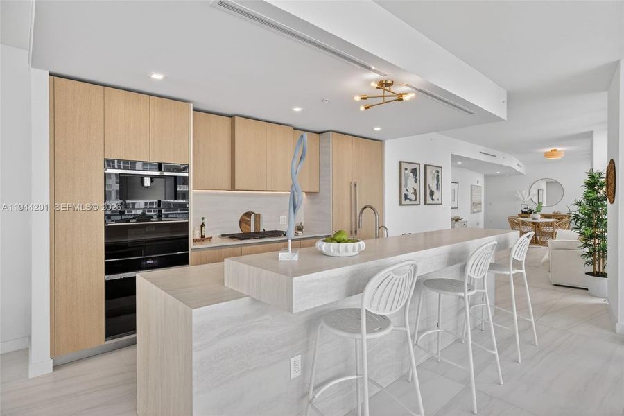 Chef-ready galley kitchen with Sub-Zero and Wolf appliances w/ wine cooler, plus integrated espresso/cappuccino system. Italian cabinetry and stone counters