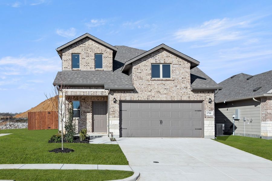 Front exterior of a new home in Keeneland, Aubrey, TX, highlighting curb appeal (Image 1). Front exterior of a new home in Keeneland, Aubrey, TX, highlighting curb appeal (Image 1).