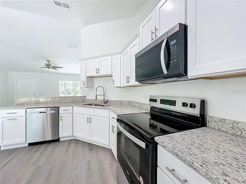 Furnished interior view inside a new home in , Dunnellon (Image 7).