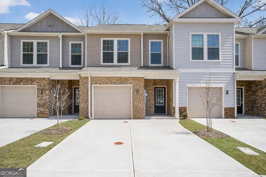 Front exterior of a new home in Morning Creek Forest, Atlanta, GA, highlighting curb appeal (Image 1). Front exterior of a new home in Morning Creek Forest, Atlanta, GA, highlighting curb appeal (Image 1).