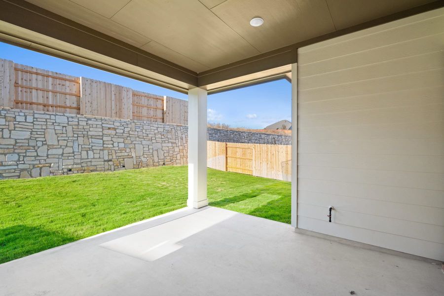 Exterior details and patio area of a home in Lariat, Liberty Hill (Image 4).