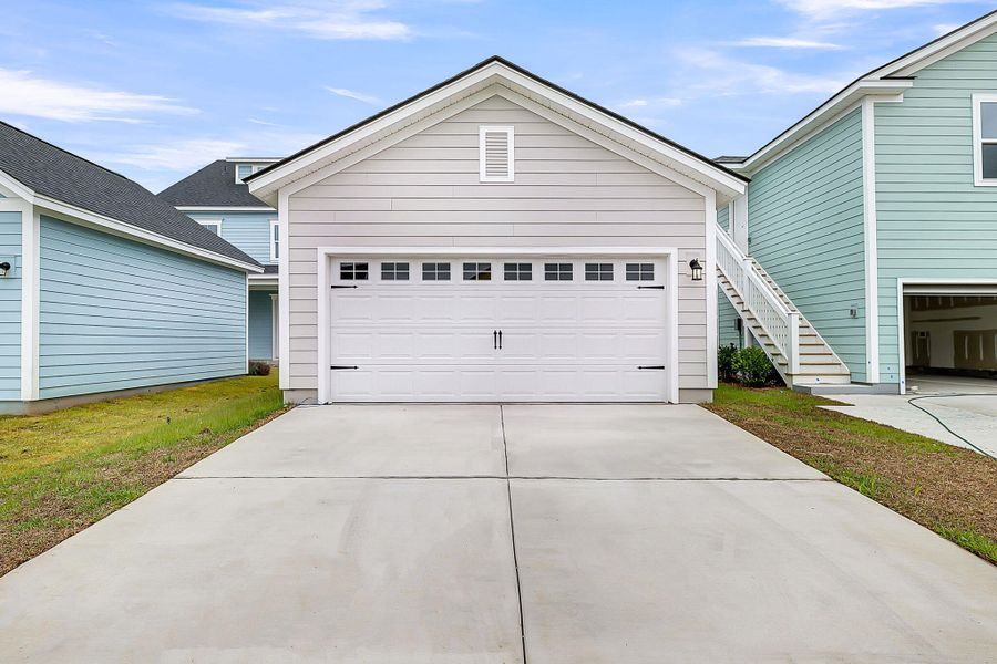 Front exterior of a new home in Nexton - Midtown - The Park Collection, Summerville, SC, highlighting curb appeal (Image 2). Front exterior of a new home in Nexton - Midtown - The Park Collection, Summerville, SC, highlighting curb appeal (Image 2).