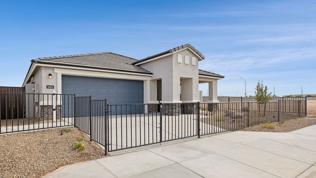 Representative exterior photo of a completed home built from the Hayden by D.R. Horton in Remington, Buckeye, AZ (Image 20).