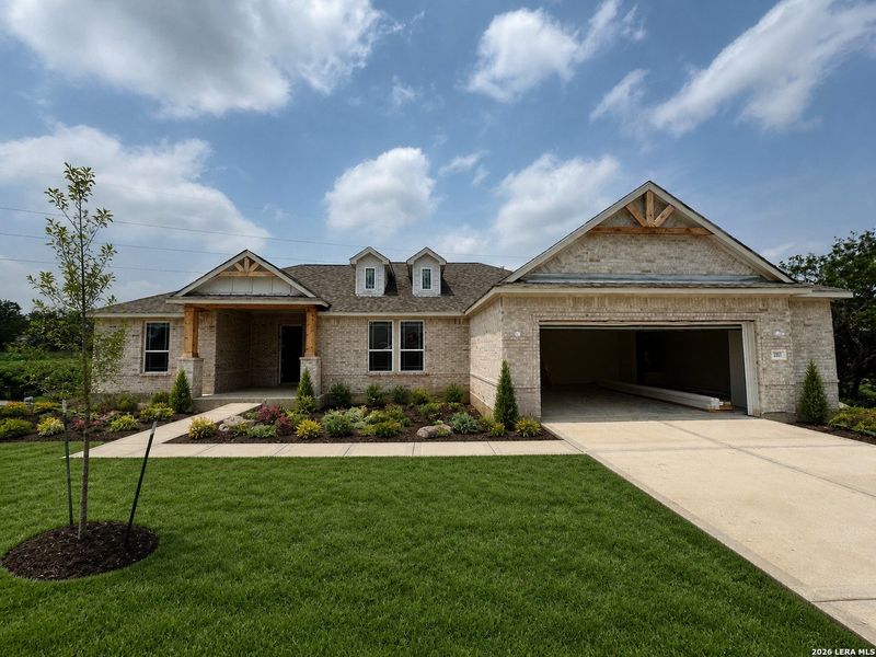 Front exterior of a new home in Jordan's Ranch, San Antonio, TX, highlighting curb appeal (Image 1). Front exterior of a new home in Jordan's Ranch, San Antonio, TX, highlighting curb appeal (Image 1).