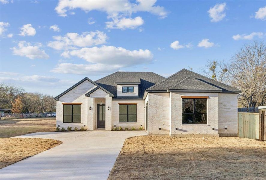 Front exterior of a new home in , Lancaster, TX, highlighting curb appeal (Image 2). Front exterior of a new home in , Lancaster, TX, highlighting curb appeal (Image 2).
