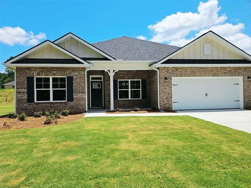 Front exterior of a new home in Park Place, Bowdon, GA, highlighting curb appeal (Image 1). Front exterior of a new home in Park Place, Bowdon, GA, highlighting curb appeal (Image 1).