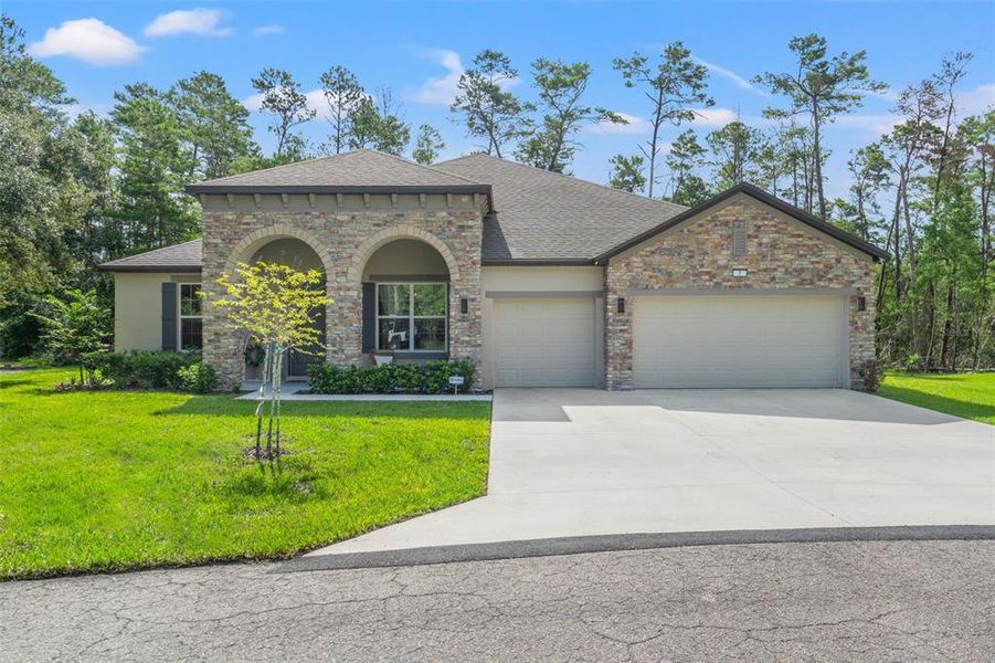 Front exterior of a new home in , Homosassa, FL, highlighting curb appeal (Image 1). Front exterior of a new home in , Homosassa, FL, highlighting curb appeal (Image 1).