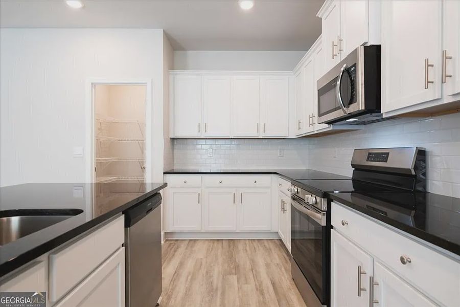 Furnished interior view inside a new home in Carson's Walk, Macon (Image 6).
