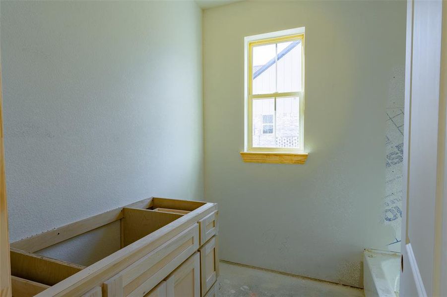 Bathroom featuring concrete flooring