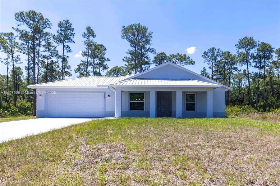 Front exterior of a new home in , Lehigh Acres, FL, highlighting curb appeal (Image 1). Front exterior of a new home in , Lehigh Acres, FL, highlighting curb appeal (Image 1).