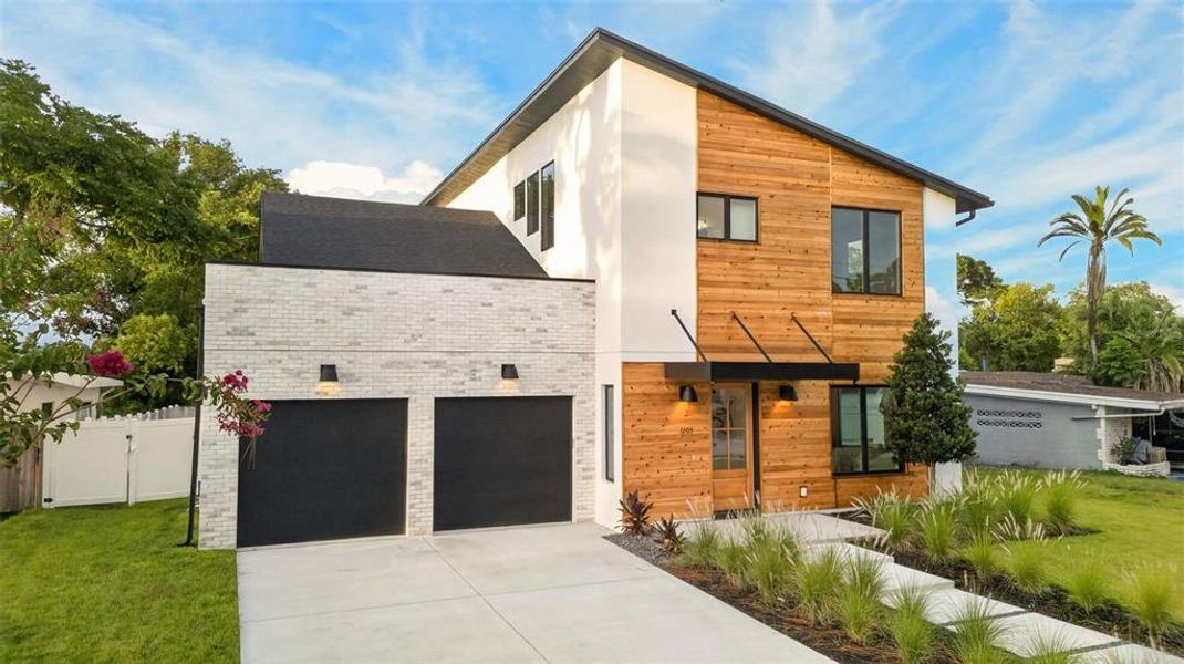Front exterior of a new home in , Orlando, FL, highlighting curb appeal (Image 2). Front exterior of a new home in , Orlando, FL, highlighting curb appeal (Image 2).