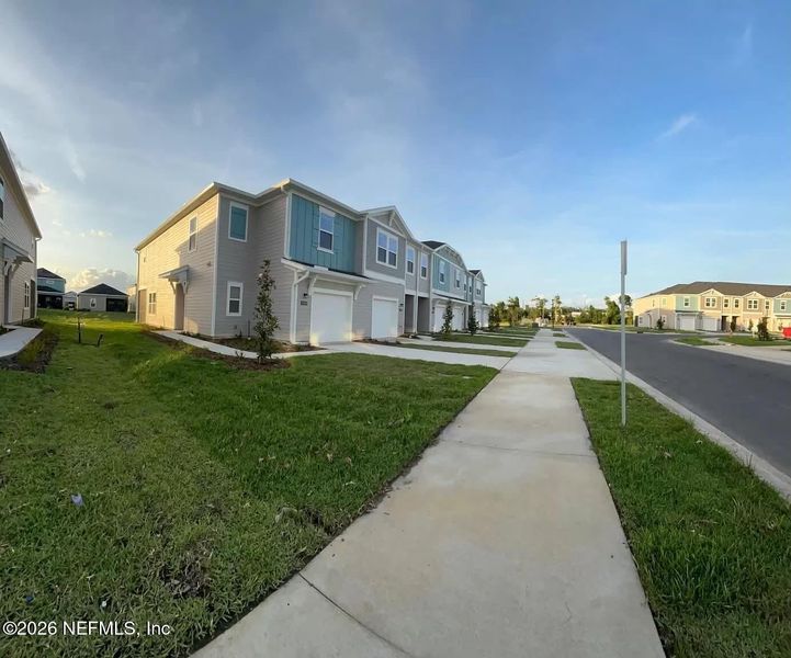 Front exterior of a new home in , Jacksonville, FL, highlighting curb appeal (Image 15).