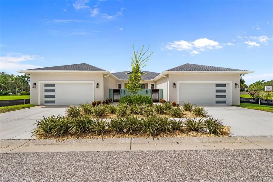 Front exterior of a new home in , Tarpon Springs, FL, highlighting curb appeal (Image 26).