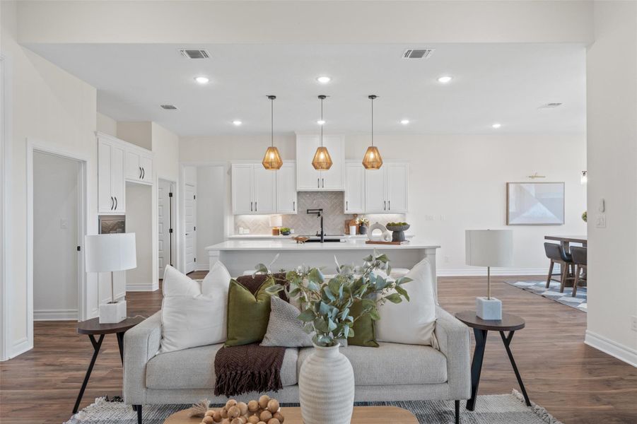 Living room featuring dark wood finished floors and recessed lighting Living room featuring dark wood finished floors and recessed lighting