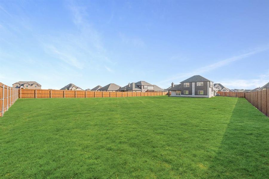 Exterior details and patio area of a home in Coyote Crossing, Godley (Image 22).