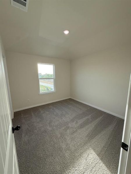 4th bedroom (upstairs) featuring dark colored carpet 4th bedroom (upstairs) featuring dark colored carpet