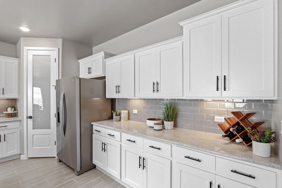 Representative furnished interior of a home built from the Pershing by Hakes Brothers in Paseo Del Este, El Paso (Image 5).