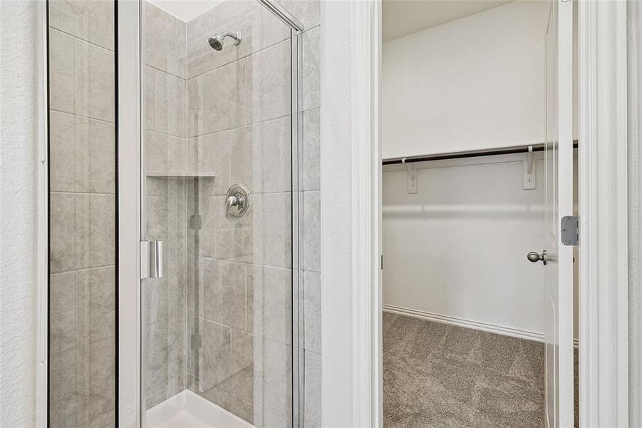 Bathroom with a shower with door