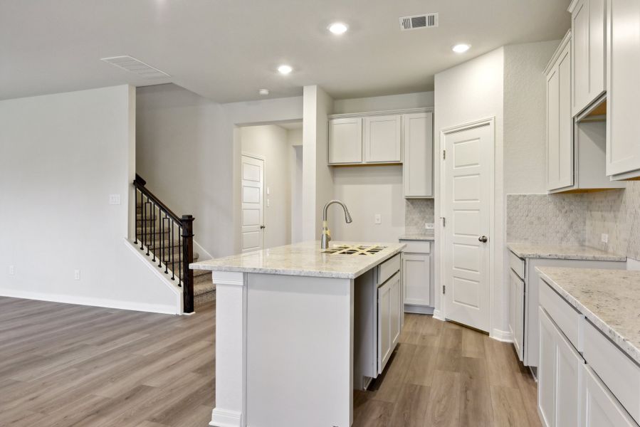 Kitchen in the Red River floorplan at a Meritage Homes community.