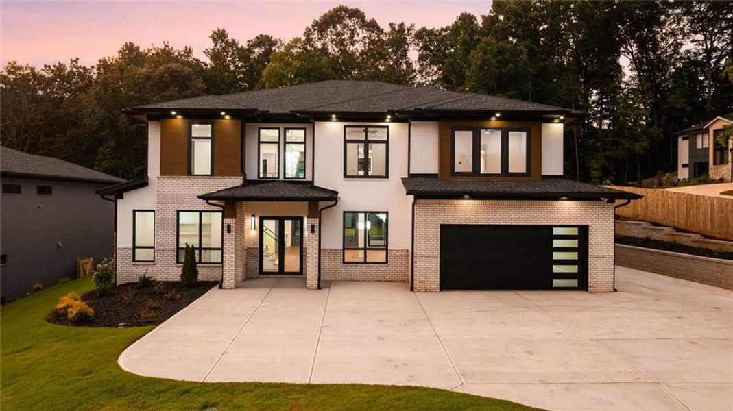 Front exterior of a new home in , Sugar Hill, GA, highlighting curb appeal (Image 36). Front exterior of a new home in , Sugar Hill, GA, highlighting curb appeal (Image 36).
