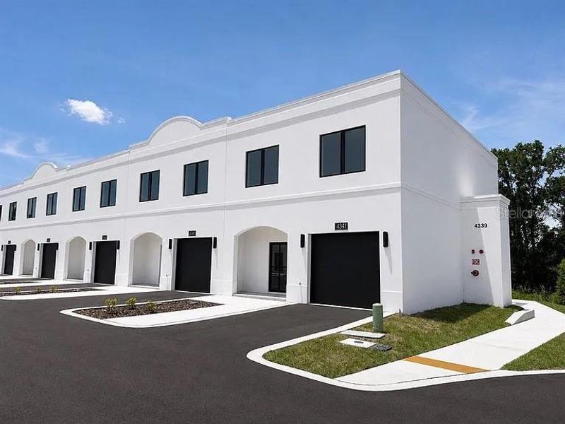 Front exterior of a new home in , Tampa, FL, highlighting curb appeal (Image 2). Front exterior of a new home in , Tampa, FL, highlighting curb appeal (Image 2).