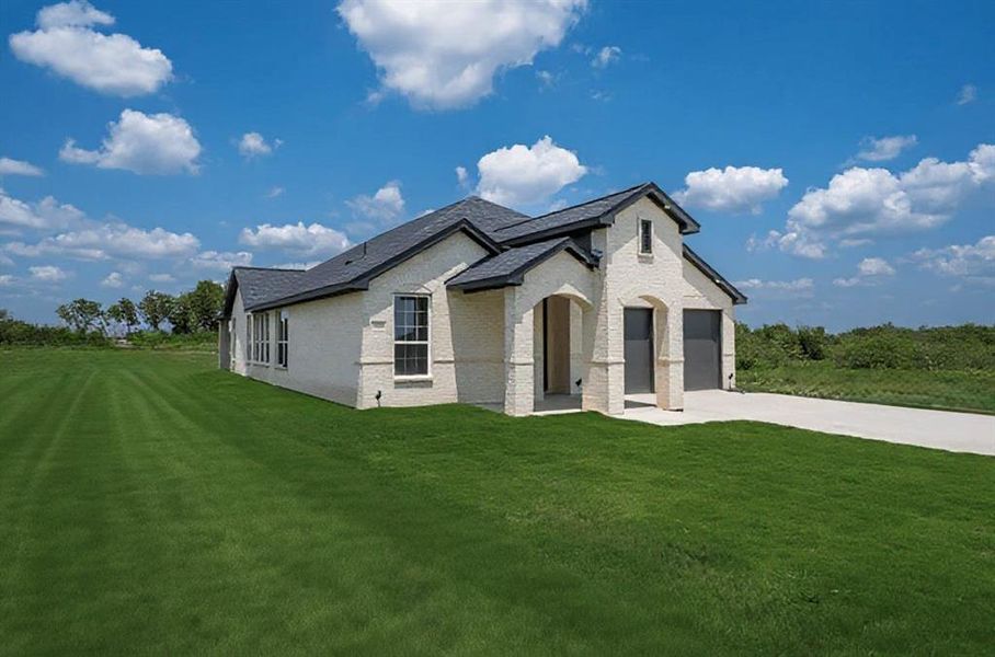 Front exterior of a new home in , Corsicana, TX, highlighting curb appeal (Image 22). Front exterior of a new home in , Corsicana, TX, highlighting curb appeal (Image 22).